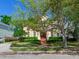Inviting two-story home with manicured landscaping, featuring a classic design and a warm, welcoming facade at 2927 W Bayshore Ct, Tampa, FL 33611