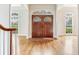 Elegant foyer showcases gleaming hardwood floors and stylish double doors, creating a welcoming entrance at 2927 W Bayshore Ct, Tampa, FL 33611