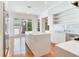 Bright kitchen with a large island, stainless steel appliances, and large windows overlooking the yard at 2927 W Bayshore Ct, Tampa, FL 33611