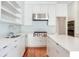 Bright kitchen with stainless steel appliances, including a range with red knobs, and a large island at 2927 W Bayshore Ct, Tampa, FL 33611