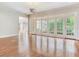 Living room featuring hardwood floors, french doors and a view to the dining room at 2927 W Bayshore Ct, Tampa, FL 33611