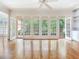 Living room with hardwood floors and french doors to outside deck at 2927 W Bayshore Ct, Tampa, FL 33611