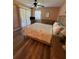 Bedroom with ceiling fan and wood-look floors at 3001 58Th Ave S # 1103, St Petersburg, FL 33712