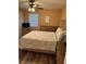 Bedroom with ceiling fan and wood-look floors at 3001 58Th Ave S # 1103, St Petersburg, FL 33712
