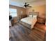 Bedroom with ceiling fan and wood-look floors at 3001 58Th Ave S # 1103, St Petersburg, FL 33712