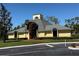 Exterior view of the clubhouse featuring a unique architectural design, with manicured landscaping at 3001 58Th Ave S # 1103, St Petersburg, FL 33712