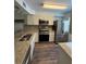 Kitchen with stainless steel appliances and granite countertops at 3001 58Th Ave S # 1103, St Petersburg, FL 33712