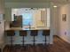 Kitchen island features granite counters and seating at 3001 58Th Ave S # 1103, St Petersburg, FL 33712