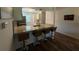 Breakfast bar, stainless sink and faucet plus granite counters in the kitchen at 3001 58Th Ave S # 1103, St Petersburg, FL 33712