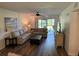 Spacious living room with stylish furnishings and sliding door access to the screened patio at 3001 58Th Ave S # 1103, St Petersburg, FL 33712