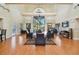 Brightly lit lounge area with hardwood floors, high ceilings, and comfortable seating, great for relaxing at 3001 58Th Ave S # 1103, St Petersburg, FL 33712