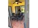 Enclosed outdoor patio with tile flooring and a comfortable seating area at 3001 58Th Ave S # 1103, St Petersburg, FL 33712