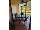 Enclosed outdoor patio with tile flooring and a seating area at 3001 58Th Ave S # 1103, St Petersburg, FL 33712