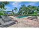 Outdoor community pool with lounge chairs and landscaped surroundings, perfect for relaxation and recreation at 3001 58Th Ave S # 1103, St Petersburg, FL 33712