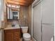 Functional bathroom with vanity, toilet, and a shower with sliding glass doors at 308 N Smokey Mountain Rd, Seffner, FL 33584