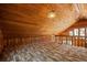 Third view of bonus room featuring wood-paneled walls, wooden railings, and plenty of natural light from the windows at 308 N Smokey Mountain Rd, Seffner, FL 33584