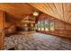 Bright bonus room featuring wood-paneled walls, a wooden bar, and plenty of natural light from the multiple windows at 308 N Smokey Mountain Rd, Seffner, FL 33584
