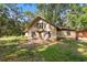 View of a home exterior featuring a covered entryway and lots of natural light at 308 N Smokey Mountain Rd, Seffner, FL 33584