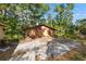 Exterior view of a detached garage, featuring a concrete parking area at 308 N Smokey Mountain Rd, Seffner, FL 33584