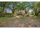 Exterior view of the home, surrounded by a lush, green landscape at 308 N Smokey Mountain Rd, Seffner, FL 33584