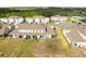 Backyard aerial showing covered patios with a spacious yard in a quiet, well-maintained community at 3138 Victoria Inlet Dr, Holiday, FL 34691