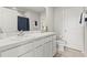 Clean bathroom features double sink vanity, tiled flooring, and neutral color palette at 3138 Victoria Inlet Dr, Holiday, FL 34691