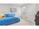 Comfortable bedroom featuring bright natural light, a cozy bed, and an artistic picture at 3138 Victoria Inlet Dr, Holiday, FL 34691