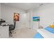 Bright bedroom featuring a TV, a cozy bed, and an artistic picture at 3138 Victoria Inlet Dr, Holiday, FL 34691