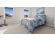 Bright bedroom with ample natural light, carpet, neutral walls, and beach themed bedding at 3138 Victoria Inlet Dr, Holiday, FL 34691