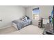 Bright bedroom features carpet floors, window with natural light, and simple furnishings at 3138 Victoria Inlet Dr, Holiday, FL 34691
