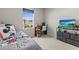 Well-lit bedroom with a desk and TV, perfect for relaxing or studying at 3138 Victoria Inlet Dr, Holiday, FL 34691
