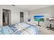 Neutral bedroom with carpet flooring, television, blue accents, and natural light at 3138 Victoria Inlet Dr, Holiday, FL 34691