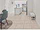 Bright kitchen features modern appliances, white cabinetry, tile floors, and a stylish island for meal prep at 3138 Victoria Inlet Dr, Holiday, FL 34691