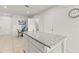 Bright kitchen featuring granite counters, an island, and a dining area for casual meals at 3138 Victoria Inlet Dr, Holiday, FL 34691