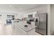 Modern kitchen with stainless steel appliances, granite countertops, and ample cabinet space, perfect for cooking at 3138 Victoria Inlet Dr, Holiday, FL 34691