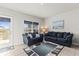 Comfortable living area with ample seating, natural light, and a view to the outdoors at 3138 Victoria Inlet Dr, Holiday, FL 34691