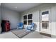 Covered patio with modern grill, outdoor seating, and a view of the yard at 3138 Victoria Inlet Dr, Holiday, FL 34691