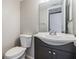 A half bath features a stylish vanity and updated fixtures at 320 N Bayshore Blvd # 208, Clearwater, FL 33759