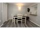 Bright dining room features a modern table, vinyl floor, and plenty of natural light at 320 N Bayshore Blvd # 208, Clearwater, FL 33759
