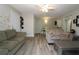 Living room with vinyl flooring, neutral paint, and an open floor plan at 320 N Bayshore Blvd # 208, Clearwater, FL 33759