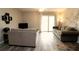 Spacious living room features durable vinyl plank flooring and neutral paint at 320 N Bayshore Blvd # 208, Clearwater, FL 33759