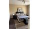 This bedroom has a queen bed, carpeted floors, and two bedside tables, each with a lamp at 3211 E 23Rd Ave, Tampa, FL 33605