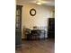 The dining room showcases a table with six chairs, wooden floors, and a classic wall clock at 3211 E 23Rd Ave, Tampa, FL 33605