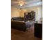 Cozy living room with leather sofas, modern entertainment unit, and sliding glass door at 3211 E 23Rd Ave, Tampa, FL 33605