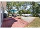 Spacious backyard featuring a well maintained lawn, patio, fire pit and a privacy fence at 4105 W Fair Oaks Ave, Tampa, FL 33611