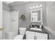 Updated bathroom with a shower-tub, gray walls, and modern vanity at 4105 W Fair Oaks Ave, Tampa, FL 33611