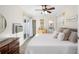 Bright bedroom featuring a sliding door, modern décor, and wood-look floors at 4105 W Fair Oaks Ave, Tampa, FL 33611
