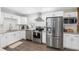 Well-appointed kitchen boasting stainless steel appliances, granite countertops, and ample cabinet space at 4105 W Fair Oaks Ave, Tampa, FL 33611