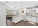 Open-concept kitchen with a breakfast bar that flows into a spacious living area at 4105 W Fair Oaks Ave, Tampa, FL 33611