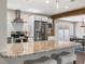 Beautiful kitchen with a breakfast bar, stainless steel appliances, and an open view to the dining area at 4105 W Fair Oaks Ave, Tampa, FL 33611